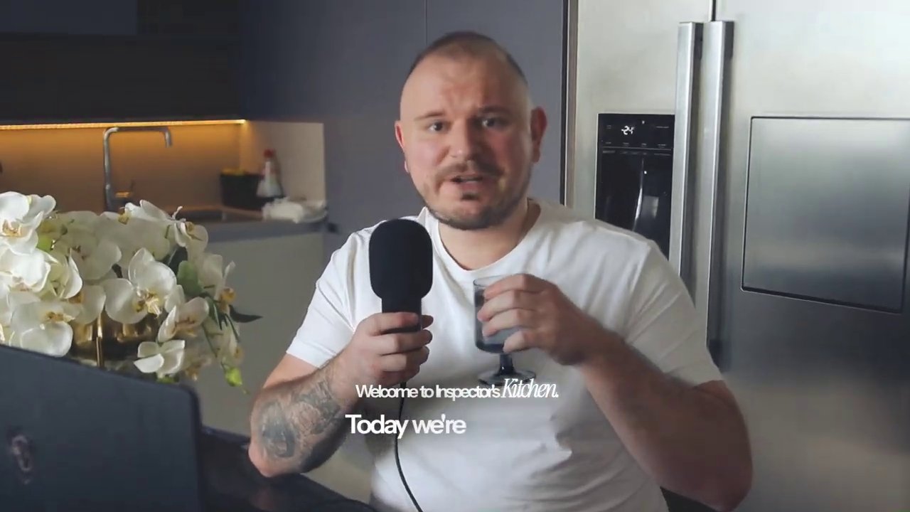 The host, Inspector, welcomes viewers from a kitchen setup, kicking off another episode of Play-to-Earn Weekly.