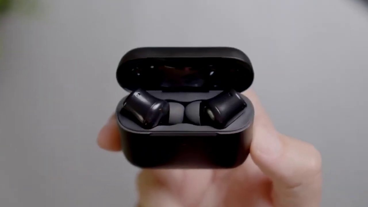 A sleek, compact pair of gaming earbuds rests on a dark surface, symbolizing the shift away from bulky headsets.