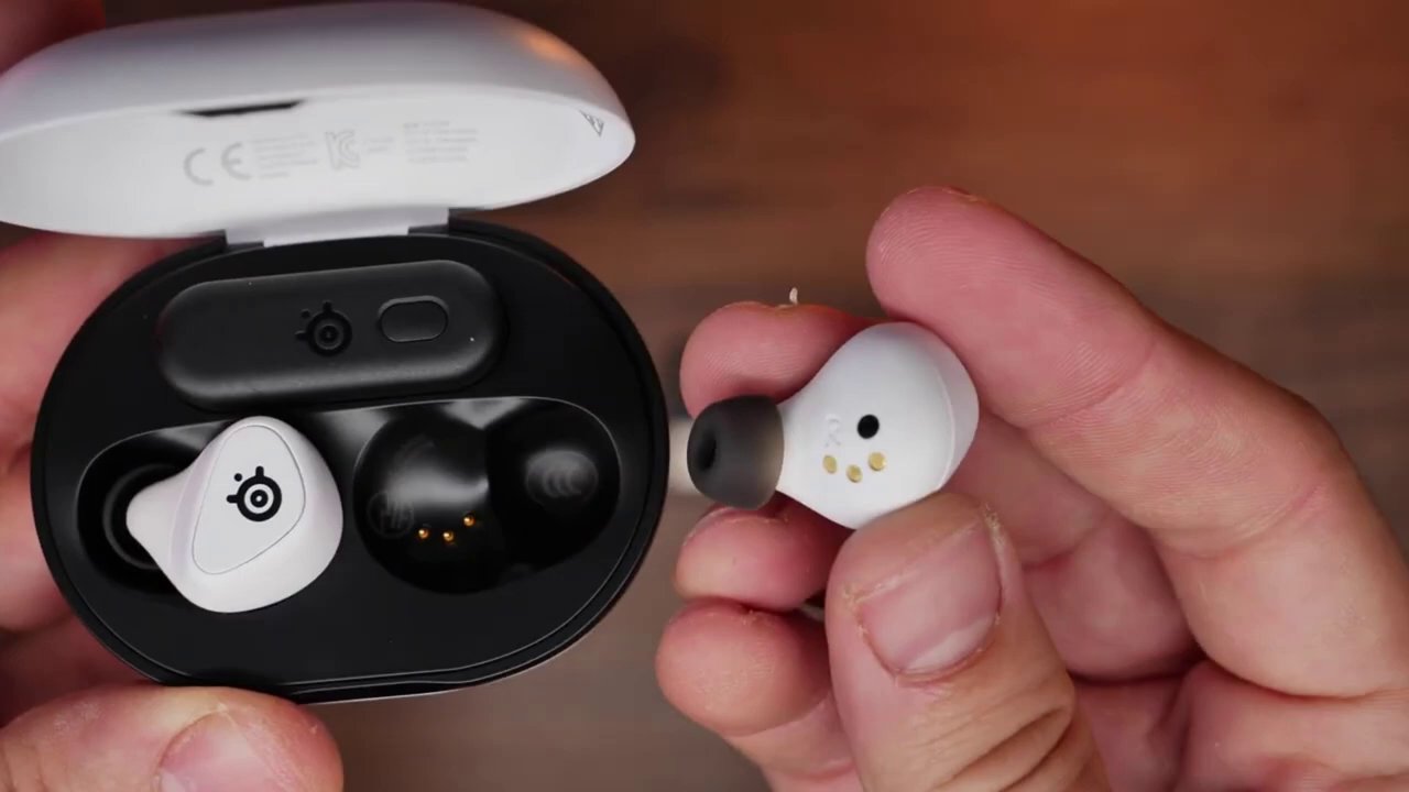 A close-up shot of the SteelSeries Arctis Game Buds in their charging case, highlighting their compact and sleek design.