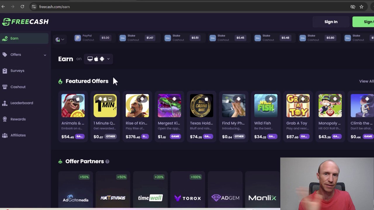 The FreeCash offer wall, showcasing a list of available gaming tasks with their respective rewards.