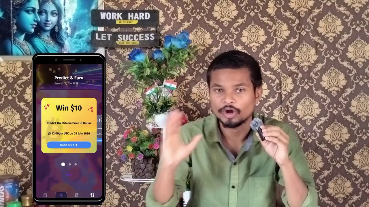 The presenter holds up a phone showing the game’s wallet screen with a connected address.